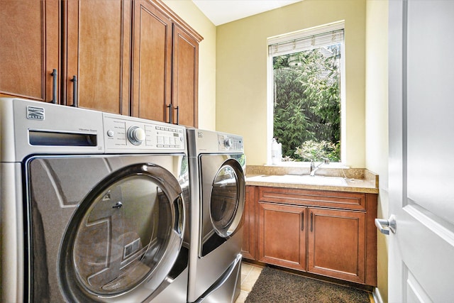 8842 Oakland Hills Cir, Portage, MI 49024 - washroom with washing machine and clothes dryer and cabinet space