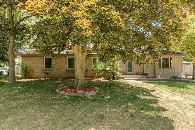 3050 Sharon Ave SW, Wyoming, MI 49519 - view of front facade featuring brick siding and a front yard