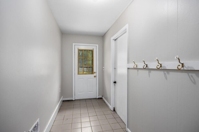 3050 Sharon Ave SW, Wyoming, MI 49519 - doorway to outside with light tile patterned flooring and baseboards