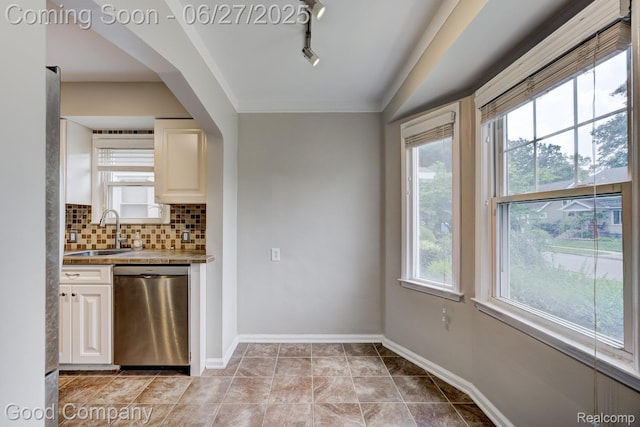 830 W Hazelhurst St, Ferndale, MI 48220 - kitchen with dishwasher, plenty of natural light, backsplash, and ornamental molding