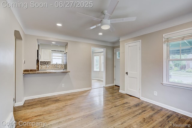 830 W Hazelhurst St, Ferndale, MI 48220 - unfurnished room with wood finished floors, a ceiling fan, recessed lighting, and ornamental molding