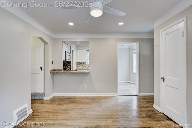 830 W Hazelhurst St, Ferndale, MI 48220 - spare room with ceiling fan, wood finished floors, and recessed lighting