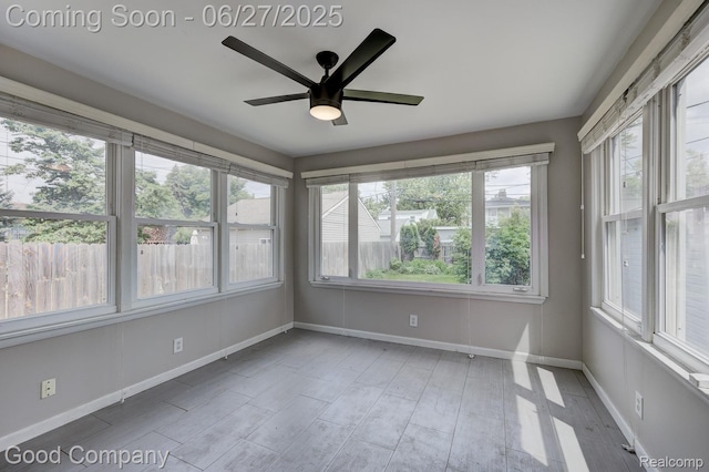 830 W Hazelhurst St, Ferndale, MI 48220 - unfurnished sunroom featuring baseboards and wood finished floors
