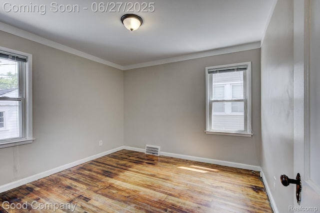 830 W Hazelhurst St, Ferndale, MI 48220 - spare room with wood finished floors and crown molding
