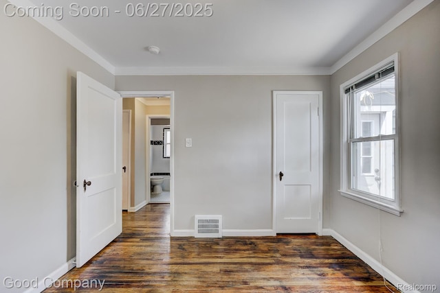 830 W Hazelhurst St, Ferndale, MI 48220 - unfurnished bedroom featuring multiple windows, wood finished floors, and ornamental molding