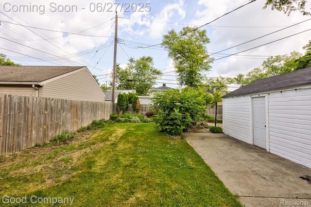 830 W Hazelhurst St, Ferndale, MI 48220 - fenced backyard featuring a patio area and an outbuilding