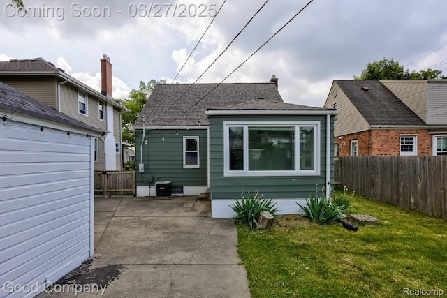 830 W Hazelhurst St, Ferndale, MI 48220 - rear view of property featuring a patio area and a shingled roof