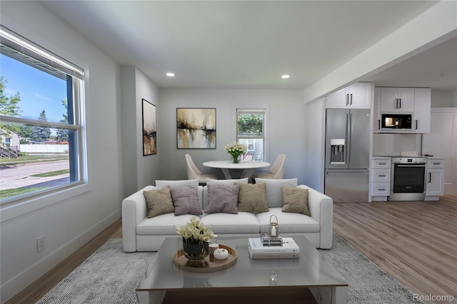 19228 Melvin St, Roseville, MI 48066 - living room featuring wood finished floors and recessed lighting