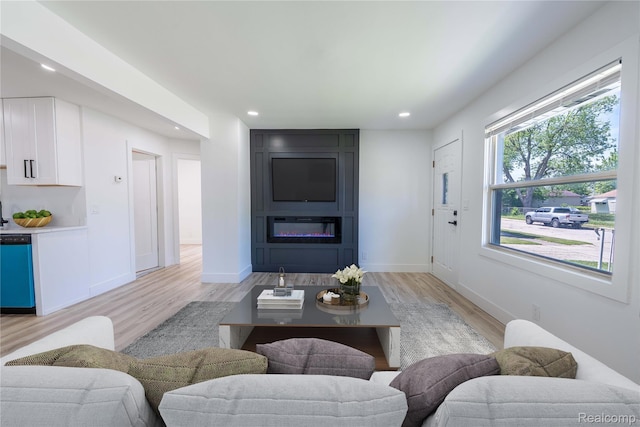19228 Melvin St, Roseville, MI 48066 - living area with light wood finished floors, recessed lighting, and a large fireplace