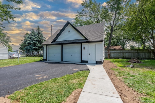 19228 Melvin St, Roseville, MI 48066 - garage at dusk featuring a garage