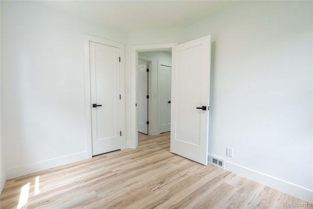 19228 Melvin St, Roseville, MI 48066 - unfurnished bedroom featuring wood finished floors and baseboards