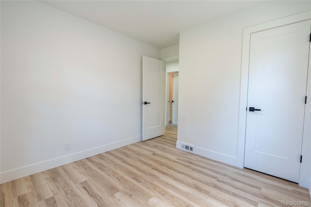 19228 Melvin St, Roseville, MI 48066 - unfurnished bedroom with light wood-type flooring and baseboards