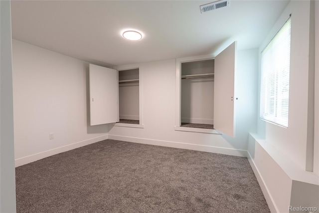 19228 Melvin St, Roseville, MI 48066 - unfurnished bedroom featuring two closets and carpet