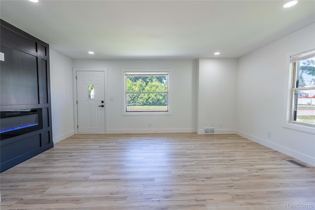 19228 Melvin St, Roseville, MI 48066 - unfurnished living room with recessed lighting and light wood-style flooring