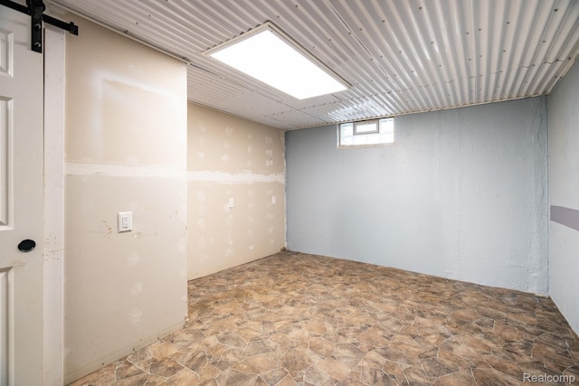 625 Whitcomb Ave, Royal Oak, MI 48073 - below grade area with stone finish floors and a barn door
