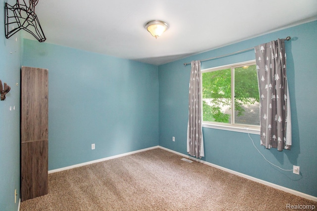 11275 Grand Oaks Dr, Clio, MI 48420 - unfurnished room featuring carpet and baseboards