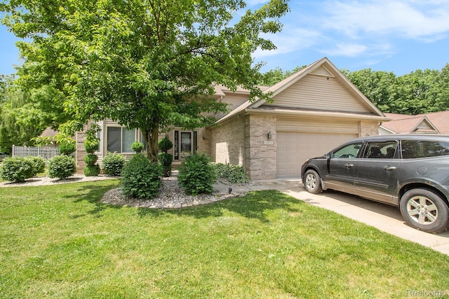 11275 Grand Oaks Dr, Clio, MI 48420 - obstructed view of property featuring a garage, brick siding, a front yard, and concrete driveway
