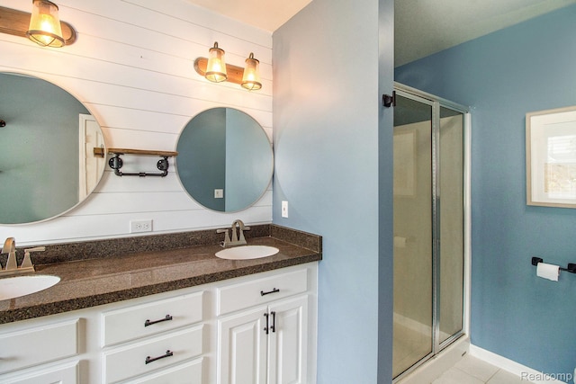 11275 Grand Oaks Dr, Clio, MI 48420 - bathroom featuring a shower stall, double vanity, and tile patterned flooring