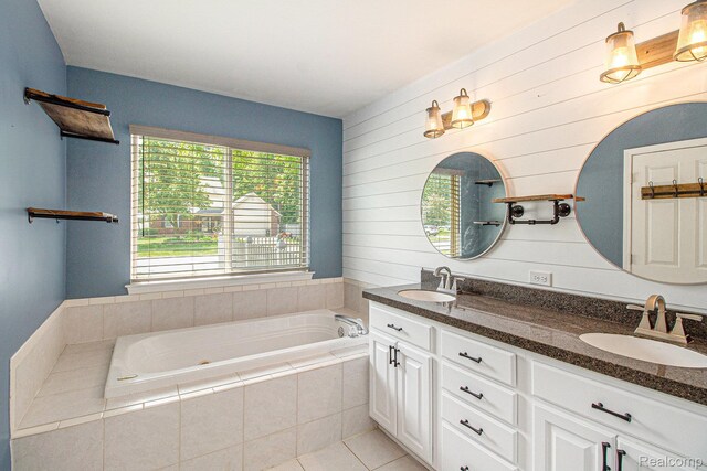 11275 Grand Oaks Dr, Clio, MI 48420 - bathroom featuring double vanity, a bath, wooden walls, and tile patterned flooring