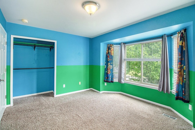 11275 Grand Oaks Dr, Clio, MI 48420 - unfurnished bedroom featuring carpet and a closet