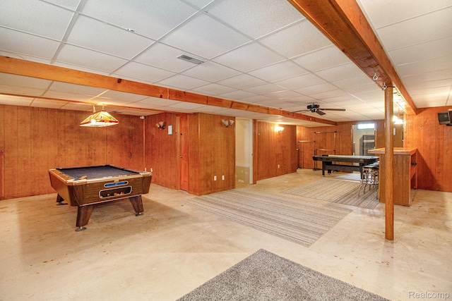 11275 Grand Oaks Dr, Clio, MI 48420 - rec room with billiards table, wood walls, concrete floors, and a paneled ceiling