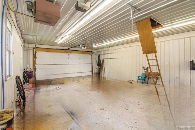 11275 Grand Oaks Dr, Clio, MI 48420 - garage featuring a garage door opener