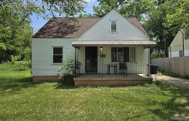 2614 Trumbull Ave, Flint, MI 48504 - bungalow featuring a porch and a shingled roof