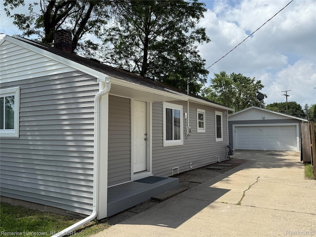 31805 Tuscola Ct, Westland, MI 48186 - view of home's exterior with a garage, an outdoor structure, and a chimney