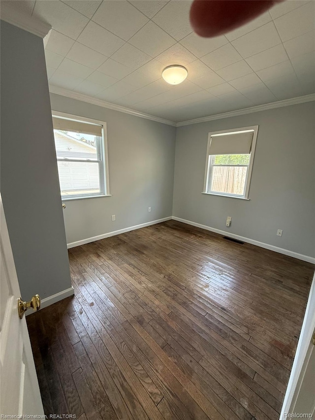 31805 Tuscola Ct, Westland, MI 48186 - empty room featuring crown molding and dark wood-style floors