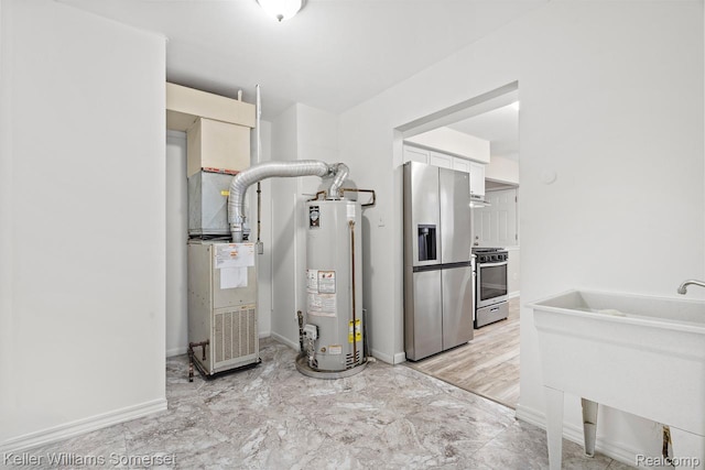 7568 Dodge Ave, Warren, MI 48091 - utilities with gas water heater and a sink