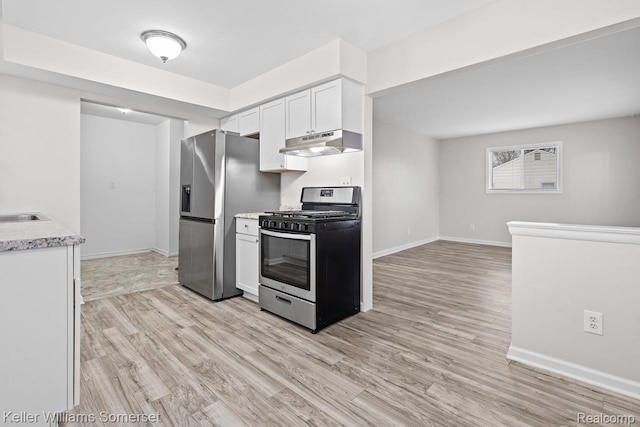 7568 Dodge Ave, Warren, MI 48091 - kitchen featuring stainless steel appliances, under cabinet range hood, light wood-style floors, and white cabinetry