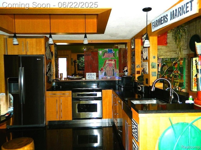 5236 Patrick Rd, West Bloomfield, MI 48322 - kitchen with oven, black fridge with ice dispenser, brown cabinetry, a peninsula, and dark countertops