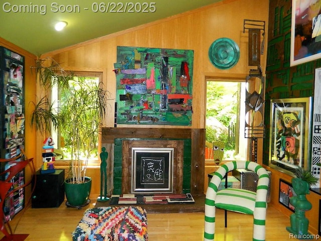 5236 Patrick Rd, West Bloomfield, MI 48322 - sitting room featuring lofted ceiling, wood finished floors, a fireplace, and plenty of natural light