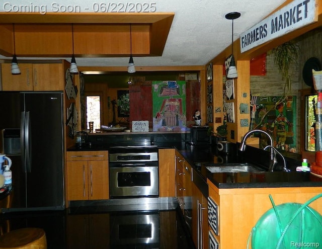 5236 Patrick Rd, West Bloomfield, MI 48322 - kitchen featuring stainless steel oven, black refrigerator with ice dispenser, brown cabinetry, and dark countertops