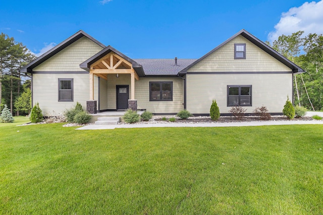 1185 N Hillside Dr, Ludington, MI 49431 - craftsman house featuring a front lawn