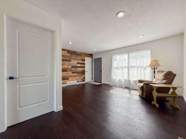 56570 Warren Dr, Dowagiac, MI 49047 - sitting room featuring wooden walls, dark wood-type flooring, and recessed lighting