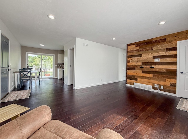56570 Warren Dr, Dowagiac, MI 49047 - living room with hardwood / wood-style flooring, recessed lighting, and wooden walls