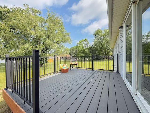 56570 Warren Dr, Dowagiac, MI 49047 - wooden deck with a lawn and view of scattered trees