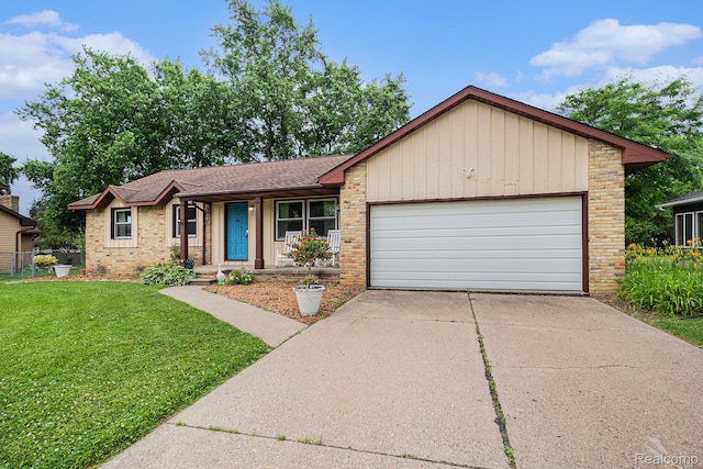 5369 Old Franklin Rd, Grand Blanc, MI 48439 - ranch-style home featuring brick siding, an attached garage, covered porch, and driveway