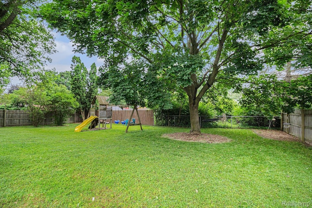 5369 Old Franklin Rd, Grand Blanc, MI 48439 - fenced backyard with a playground