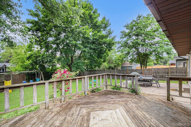 5369 Old Franklin Rd, Grand Blanc, MI 48439 - deck featuring a fenced backyard, a playground, and outdoor dining area