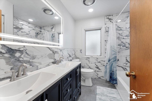 1617 Davis St, Wyandotte, MI 48192 - bathroom with tile walls, double vanity, shower / bath combo, and recessed lighting