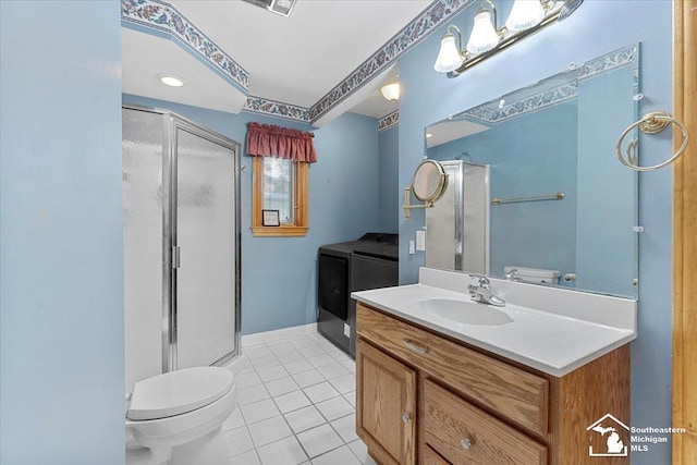 1617 Davis St, Wyandotte, MI 48192 - bathroom featuring washer and dryer, tile patterned floors, a stall shower, and vanity