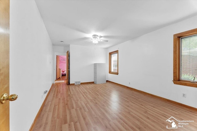 1617 Davis St, Wyandotte, MI 48192 - empty room with light wood-style floors and a ceiling fan