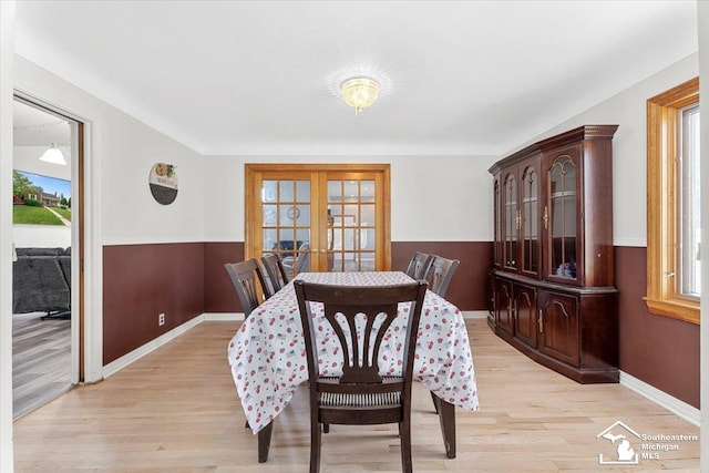 1617 Davis St, Wyandotte, MI 48192 - dining space featuring light wood finished floors and french doors