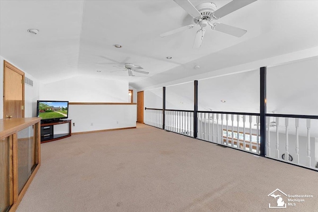 1617 Davis St, Wyandotte, MI 48192 - unfurnished living room with a ceiling fan, light colored carpet, and vaulted ceiling