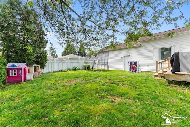 1617 Davis St, Wyandotte, MI 48192 - fenced backyard with a shed