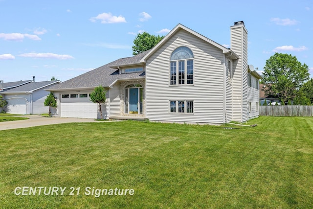 2364 Milford Dr, Saginaw, MI 48603 - view of front of property with a chimney, concrete driveway, and an attached garage