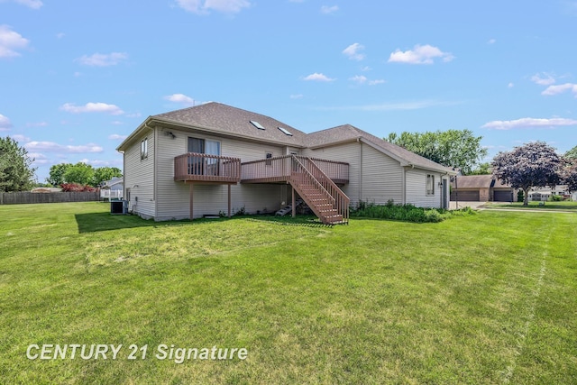 2364 Milford Dr, Saginaw, MI 48603 - back of property with a wooden deck, stairway, and a detached garage