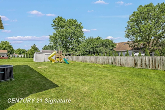 2364 Milford Dr, Saginaw, MI 48603 - fenced backyard with a playground and a storage unit